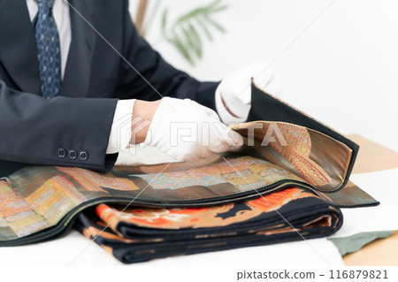 Man assessing recycling purchase in hand 116879821