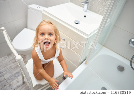 smiling little child in the bathroom 116880519