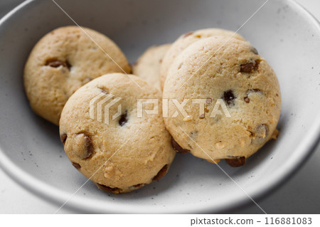 American Twix soft cookies with chocolate and caramel drops in white bowl 116881083