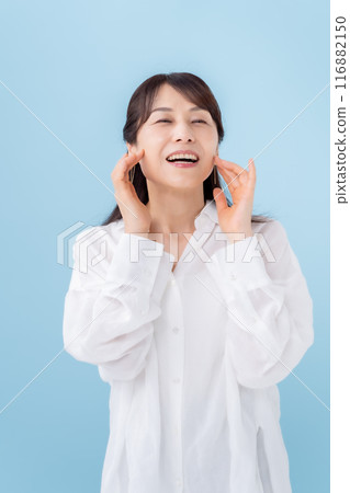 Woman touching her cheek beauty 116882150