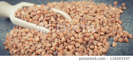 Heap of buckwheat containing vitamins and dietary fiber. Healthy nutrition Heap of buckwheat containing vitamins and dietary fiber. Healthy nutrition 116883597