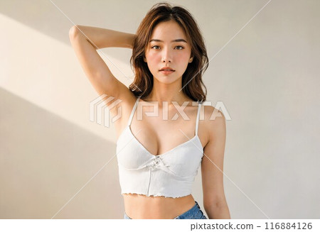 Young woman wearing a white tank top, white background Young woman wearing a white tank top, white background 116884126