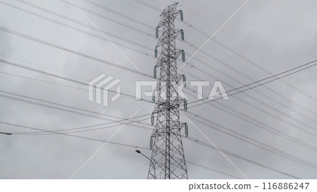 Magnificent high voltage electricity transmission tower and lines with cloudy sky bakground. Magnificent high voltage electricity transmission tower and lines with cloudy sky bakground. 116886247