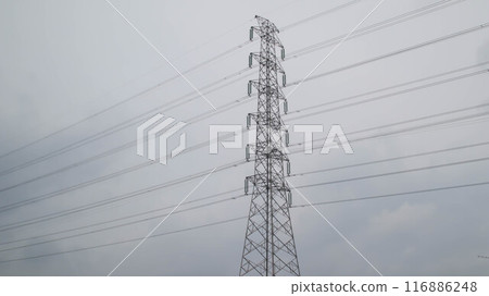Magnificent high voltage electricity transmission tower and lines with cloudy sky background. Magnificent high voltage electricity transmission tower and lines with cloudy sky background. 116886248