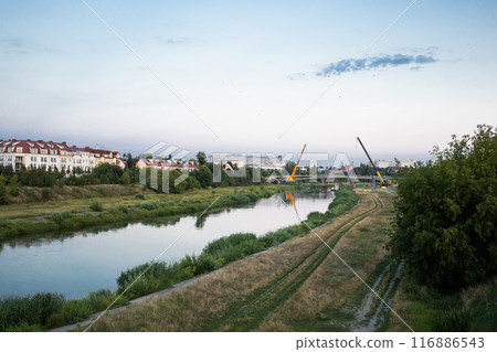 Process of building a new bridge through Warta river in Poznan, Poland 116886543