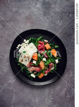 salad, melon with prosciutto, arugula, and cheese, summer salad, vegetarian, homemade, no people, 116886599