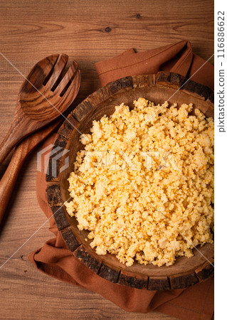 cooked couscous, in a wooden bowl, top view, no people, 116886622