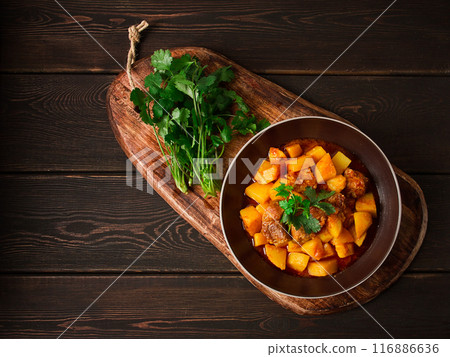Potatoes stewed with meat, in tomato sauce, with spices and herbs, no people, 116886636