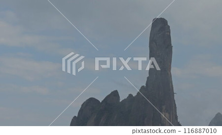 Rocky Pinnacle Shaped Like a Pointing Finger Reaching the Sky Rocky Pinnacle Shaped Like a Pointing Finger Reaching the Sky 116887010
