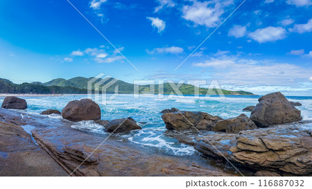 Tropical Beach Paradise with Blue Waters and Rocky Shores Tropical Beach Paradise with Blue Waters and Rocky Shores 116887032