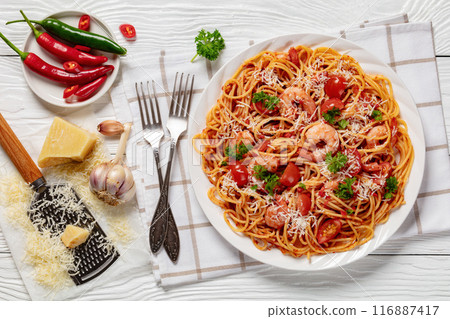 shrimp fra diavolo with spaghetti on a plate shrimp fra diavolo with spaghetti on a plate 116887417