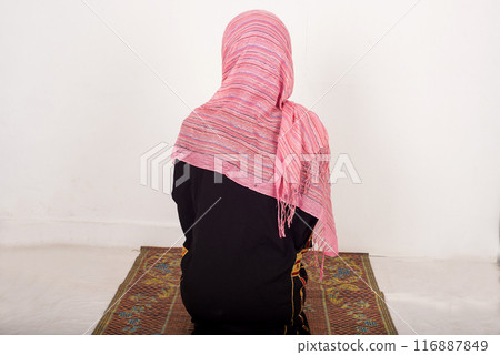 portrait of praying muslim woman, indoors portrait of praying muslim woman, indoors 116887849