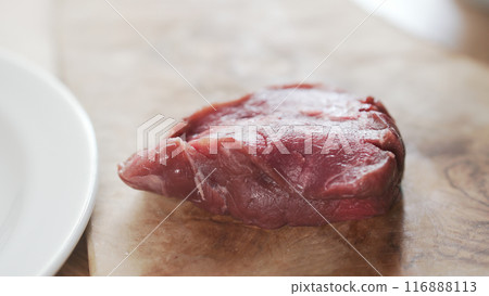raw beef fillet for steak on wooden board 116888113