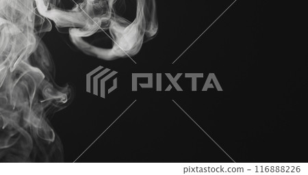 closeup vapor rises from bottom on black background closeup vapor rises from bottom on black background 116888226