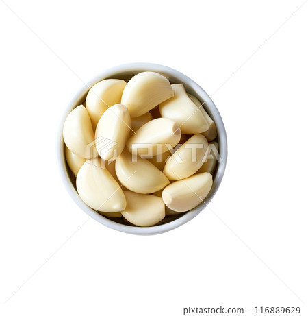 garlic in a ceramic bowl isolated on white background, top view. 116889629