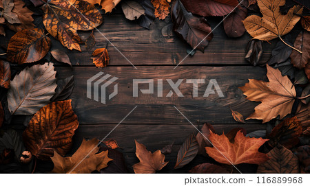 AI-generated image of various sizes of fallen leaves on a wooden table with a central copy space 116889968