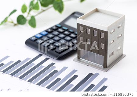 Corporate office building with graphs and calculator 116893375