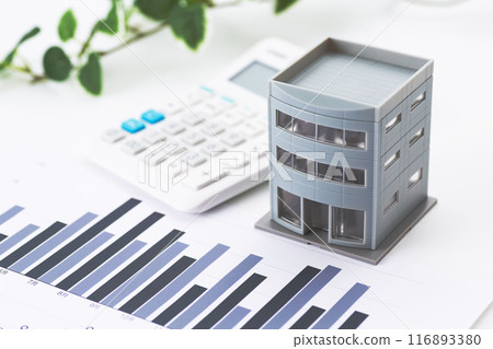 Corporate office building with graphs and calculator 116893380