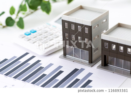 Corporate office building with graphs and calculator 116893381
