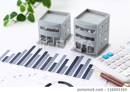 Corporate office building with graphs and calculator 116893384