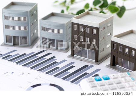 Corporate office building with graphs and calculator 116893824
