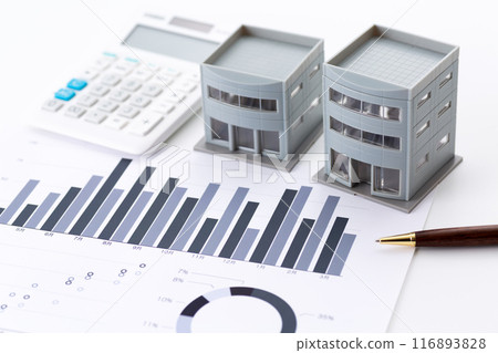 Corporate office building with graphs and calculator 116893828