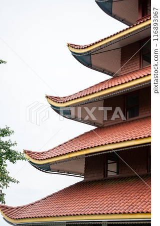 Overview of an Asian Pagoda looking over a forest and city. Overview of an Asian Pagoda looking over a forest and city. 116893967