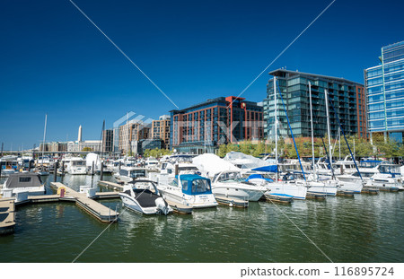 Modern buildings and yachts ducked at the Wharf District newly developed waterfront area in Washington D.C. 116895724
