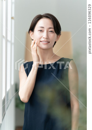 Woman touching her cheek beauty 116896329