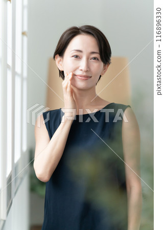 Woman touching her cheek beauty 116896330