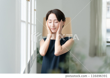 Woman touching her cheek beauty 116896391