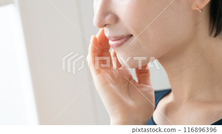 Woman touching her cheek beauty 116896396