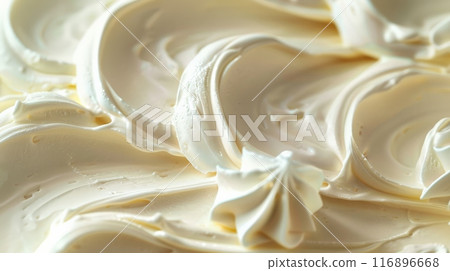 Smooth texture of rich, creamy whipped cream in a close-up view. Perfect for food textures and dessert concepts. 116896668