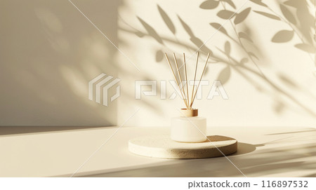 Empty beige table podium with reed stick diffuser in sunlight 116897532