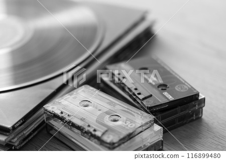 Stacks of record jackets, LP records and cassette tapes 116899480