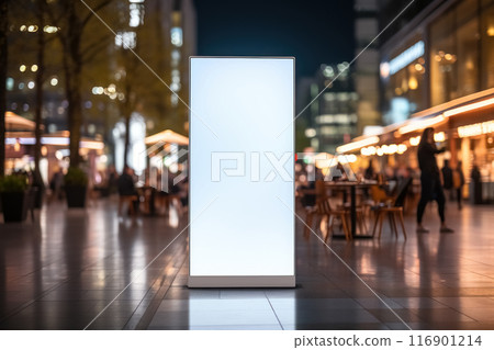 Vertical blank white advertising billboard on the evening street, banner frame for advertisement and information 116901214