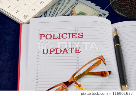 Policies Update Written strategic inscription, explanation, conceptual idea in a composition with motivating elements of banknotes Policies Update Written strategic inscription, explanation, conceptual idea in a composition with motivating elements of banknotes 116901653