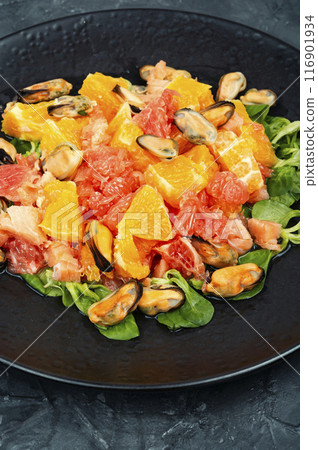 Salad with orange and mussels. 116901934