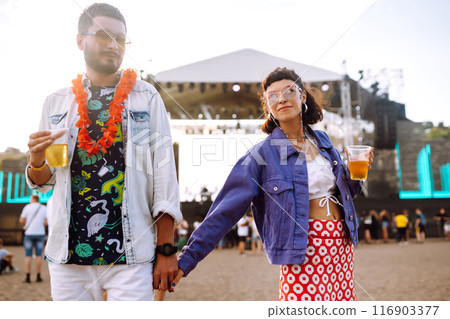 Couple with beer at music festival. Summer Beach party, holiday, vacation concept. 116903377