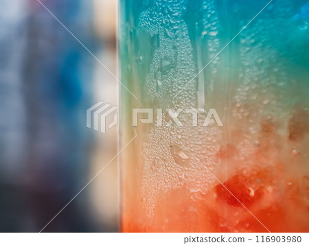 Refreshing colorful beverage in a frosted glass captured on a warm summer day Refreshing colorful beverage in a frosted glass captured on a warm summer day 116903980