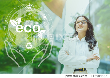 Asian India business success working women standing with proud at green city office building overlay eco saving graphics concept. Asian India business success working women standing with proud at green city office building overlay eco saving graphics concept. 116904383