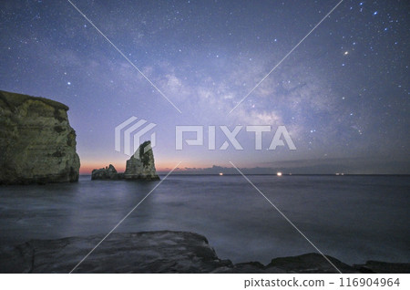 The Milky Way over Candle Rock before dawn The Milky Way over Candle Rock before dawn 116904964
