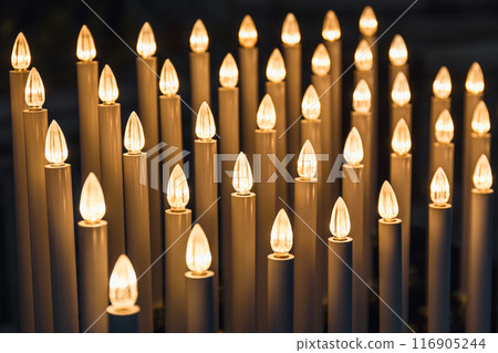 Candle lights burning in St. Peter's Basilica, Vatican, Rome, Italy Candle lights burning in St. Peter's Basilica, Vatican, Rome, Italy 116905244