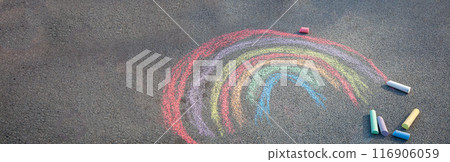 Sidewalk chalk drawing. A rainbow painted on the asphalt. Kids activities 116906059