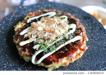 Okonomiyaki grilled on a multi-griddle Okonomiyaki grilled on a multi-griddle 116908819