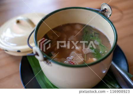 Tom yum, Thai Seafood spicy soup in Thai style bowl. Tom yum, Thai Seafood spicy soup in Thai style bowl. 116908923