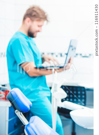 Doctor working on laptop at the working place Doctor working on laptop at the working place 116911430