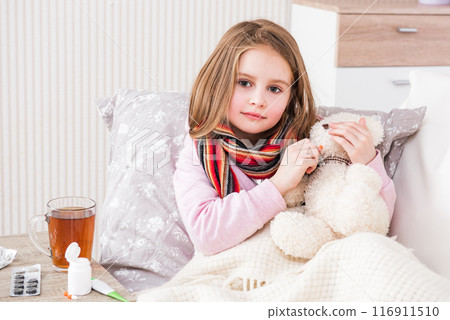 Little ill girl with scarf with teddy bear Little ill girl with scarf with teddy bear 116911510