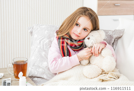 Little ill girl with scarf with teddy bear 116911511