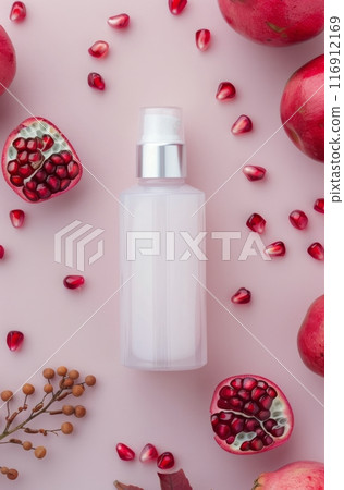 Pomegranate Juice, Powder, and Seeds on Pink Background 116912169